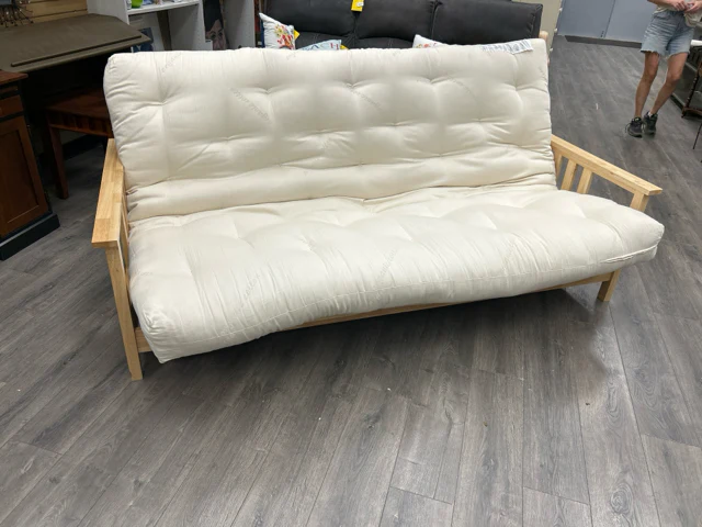 TAN CUSHION FUTON ON BLONDE WOOD FRAME