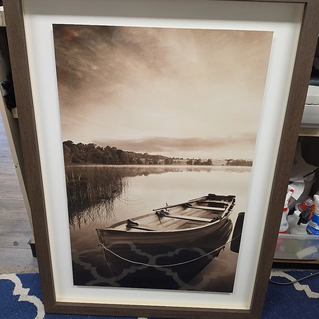 WOODEN DINGY IN POND